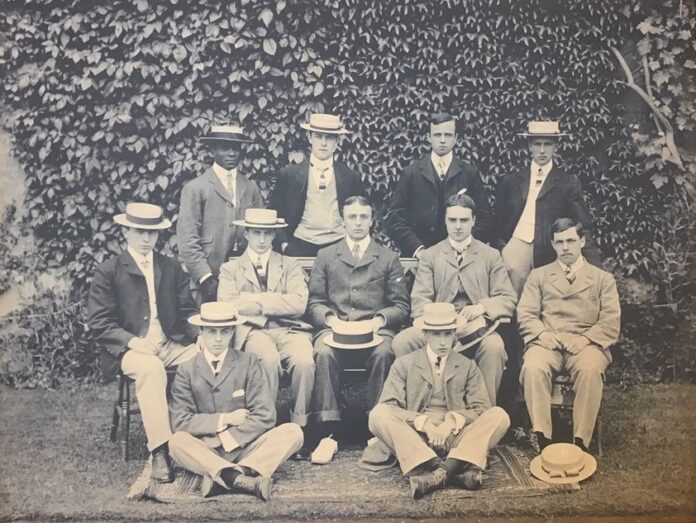 Edward Theophilus Nelson, standing, first on the left, with a group of students